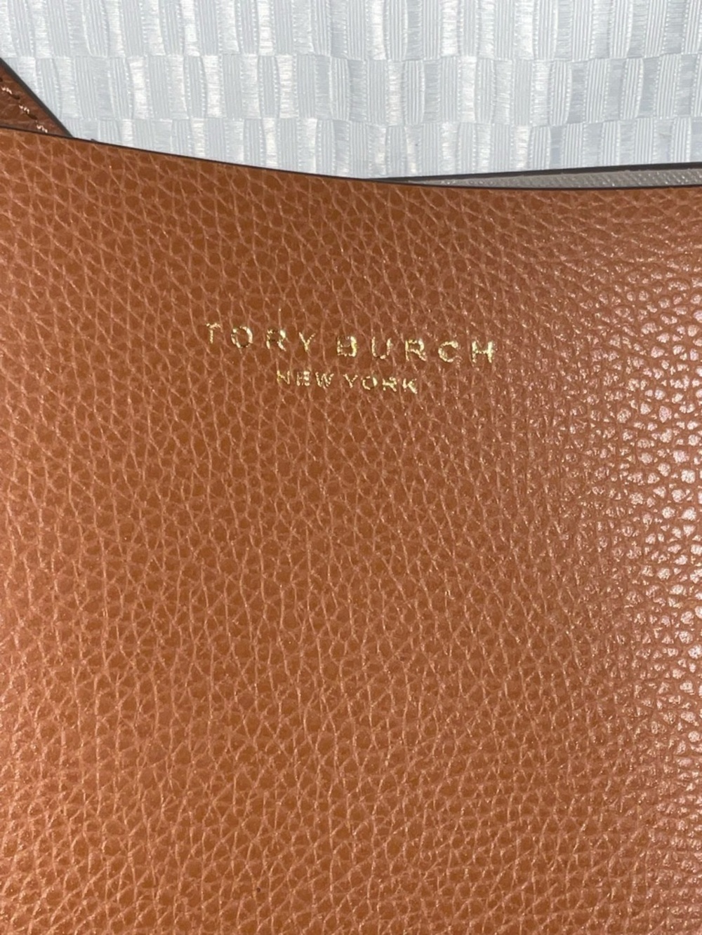 Tory Burch Pebbled Leather tote.
Cognac with Gold Logo